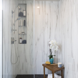 Large format tiles for the slab look without the slab price. Remodeled Master Shower in Milwaukee Home