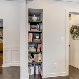 A functional yet charming custom built-in Embedded Bookshelf in Wisconsin Home Remodel