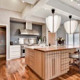 Kitchen with island and stainless steel range Kitchen Remodeling Services Milwaukee