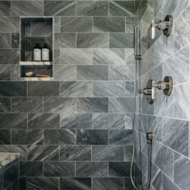 Modern comfort with style showcased with stone bathroom walls Bathroom Remodel in West Bend, WI